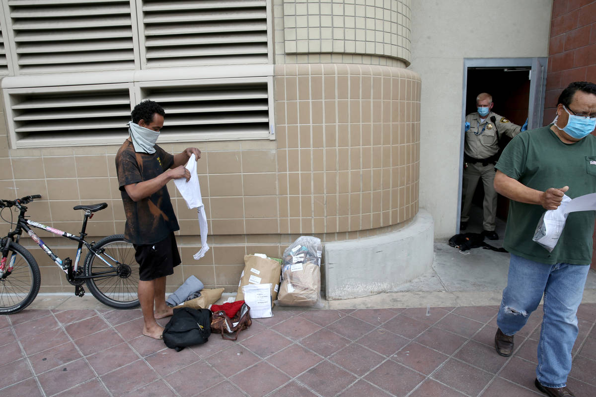 Micah "Aqua" Peoples, left, is released from the Clark County Detention Center in downtown Las ...