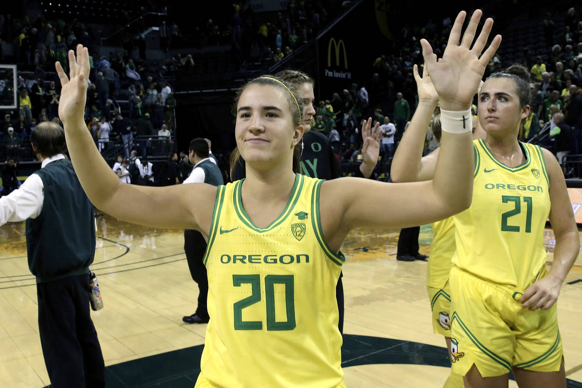 FILE - In this Nov. 16, 2019, file photo, Oregon's Sabrina Ionescu acknowledges the crowd with ...