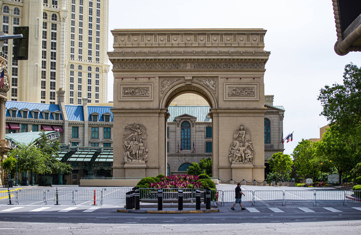 A man passes the Paris Las Vegas along the Las Vegas Strip on Thursday, April 16, 2020. (Chase ...