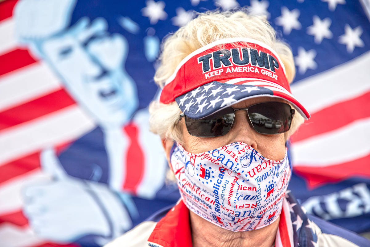 Linda Buckardt takes part in a protest outside the Grant Sawyer State Office Building organized ...