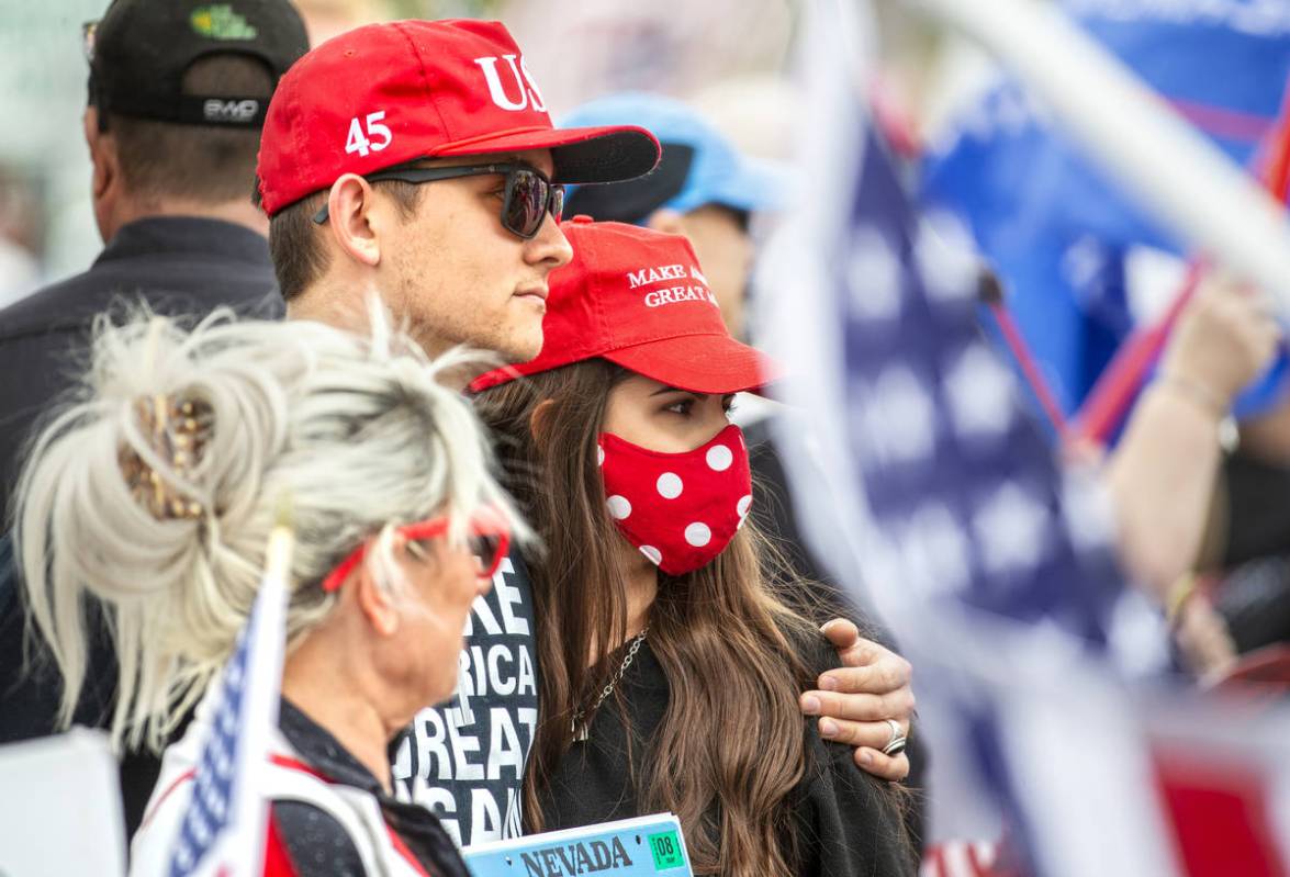 Bryce Nass, left, and Ginet Gutierrez take part in a protest during an event organized by Reope ...