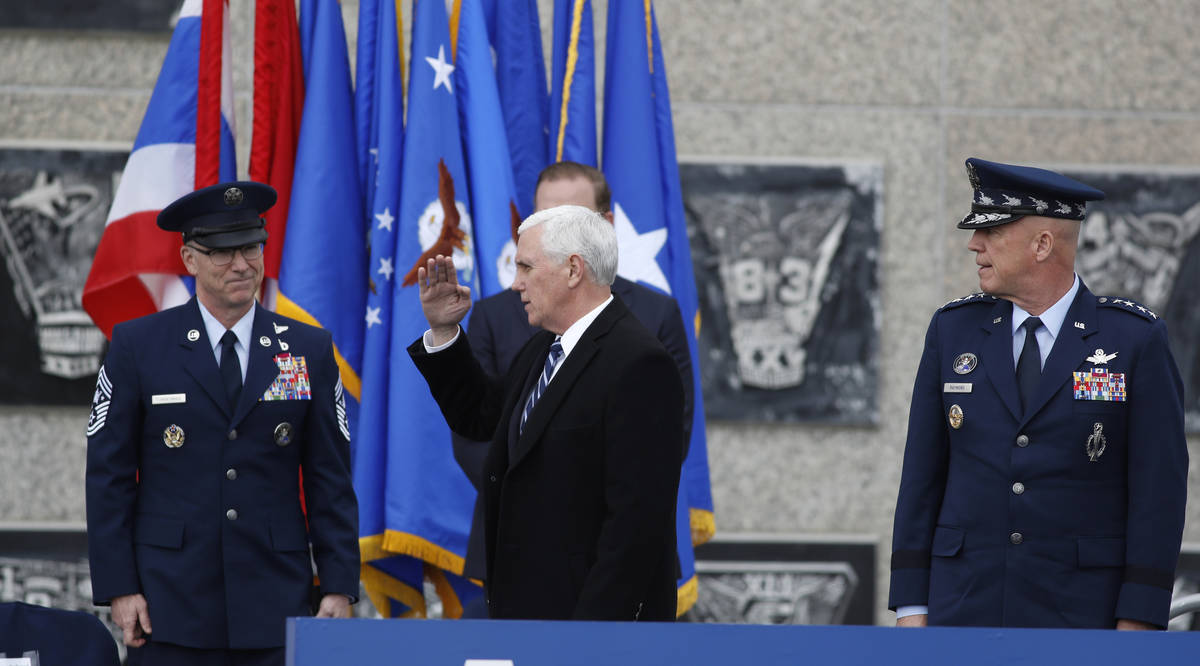 Vice President Mike Pence arrives on stage to speak at the graduation ceremony for the class of ...