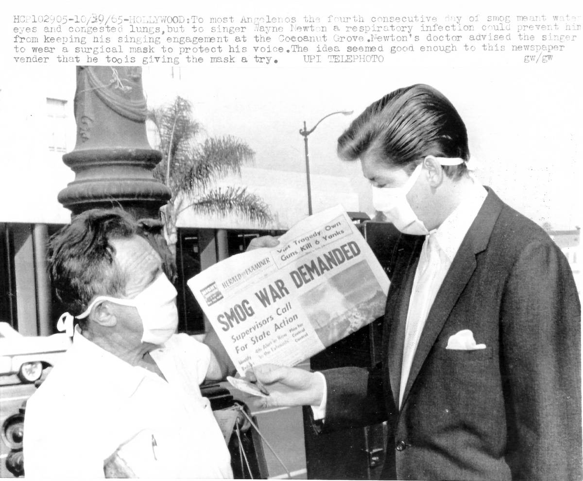 Wayne Newton is shown wearing a medical mask in this United Press International photo in Los An ...