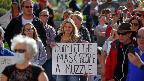 People gather during the Utah Business Revival rally, which wants Utah's economy to be re-opene ...