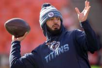 Tennessee Titans' Marcus Mariota warms up before the NFL AFC Championship football game against ...