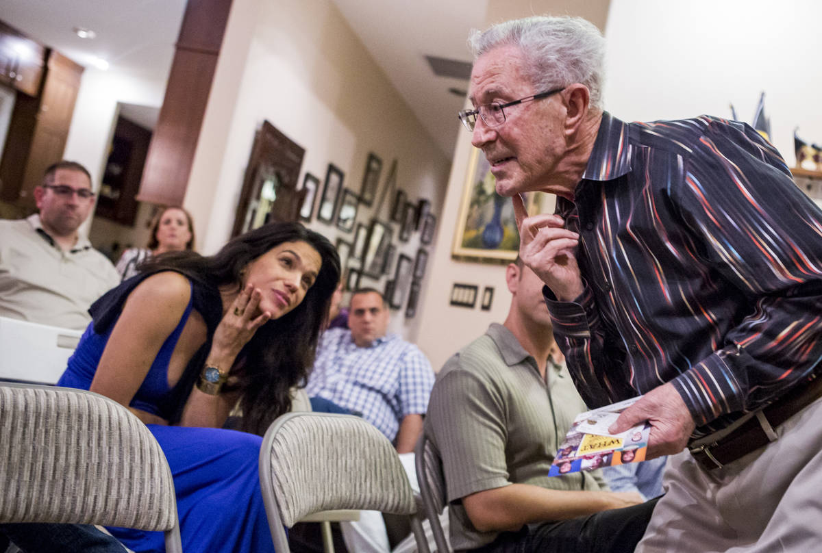 Ben Lesser, a 91-year-old Holocaust survivor, shows where he was stabbed in the chin while on a ...