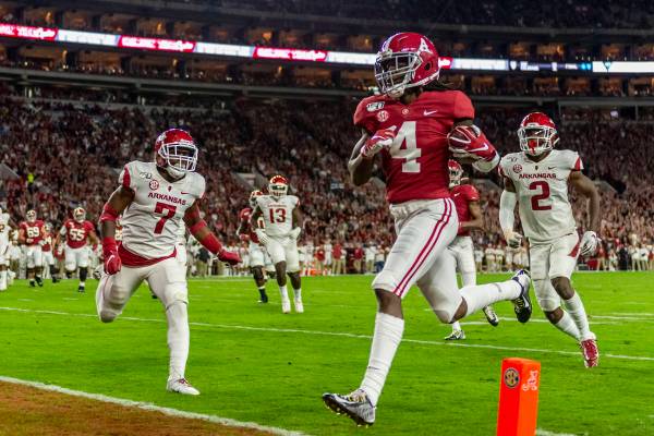 FILE - In this Oct. 26, 2019, file photo, Alabama wide receiver Jerry Jeudy (4) scores on a pas ...