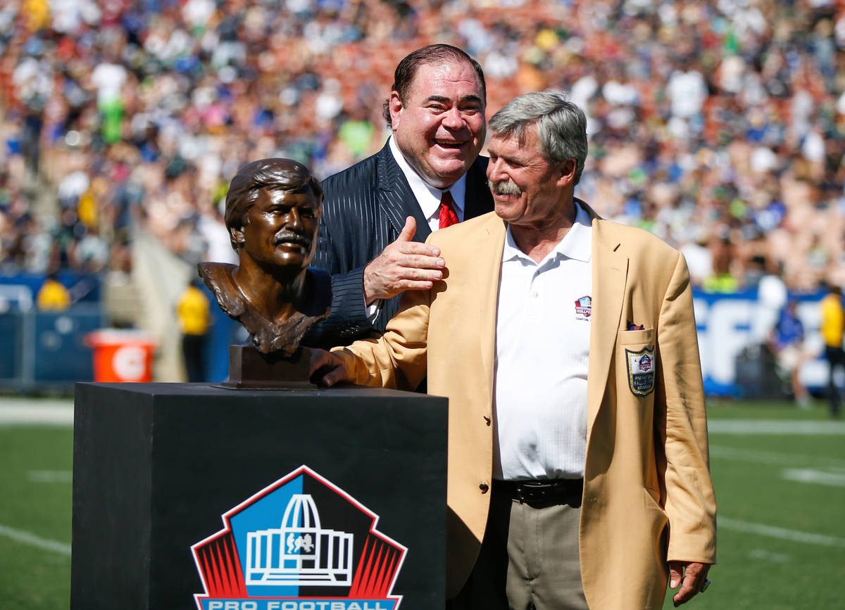 Los Angeles Rams Hall of Famer Tom Mack stands with his bust as Pro Football Hall of Fame Presi ...