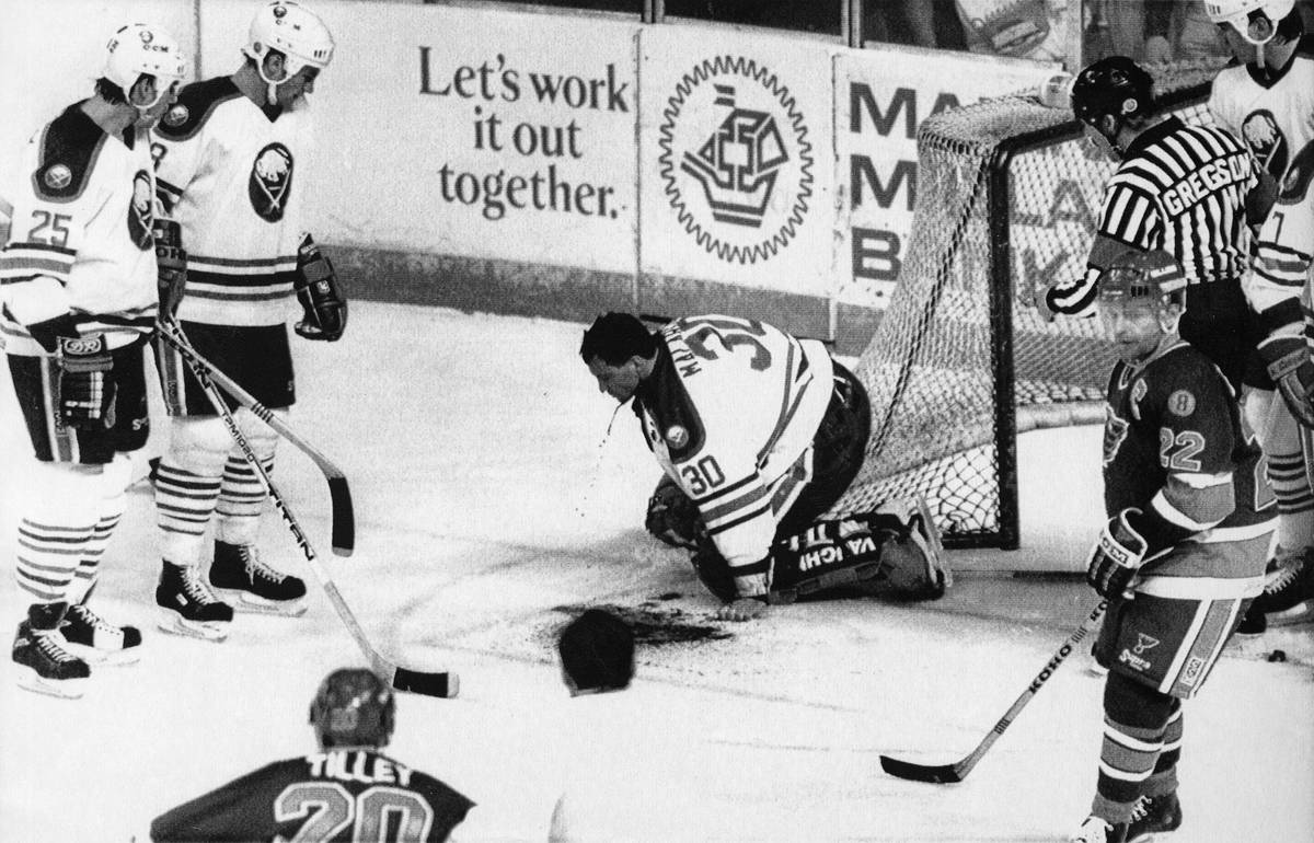 EDS NOTE - GRAPHIC CONTENT Buffalo Sabres goalie Clint Malarchuk clutches his throat after suff ...