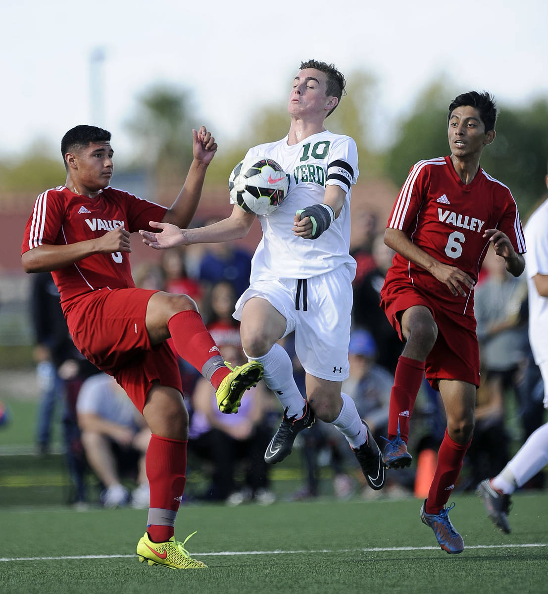 Palo Verde striker Nolan Sherwood (10) cradles a goal kick in front of Valley defender Abraham ...