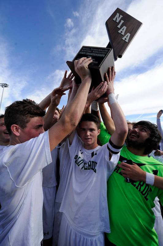 Palo Verde players celebrate their 2-1 victory over Valley during the Division I boys state soc ...