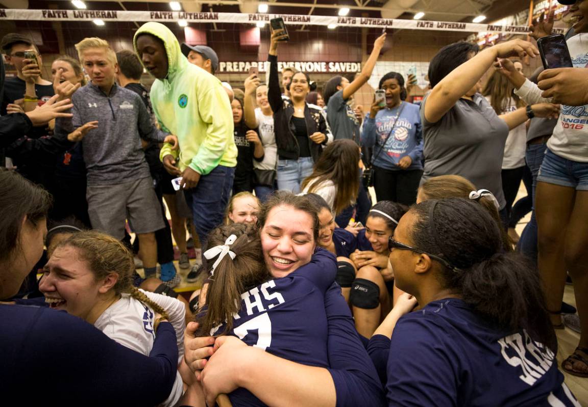 Shadow Ridge seniors Whittnee Nihipali (15) and Meghan Hoadley (7) celebrate with their team af ...