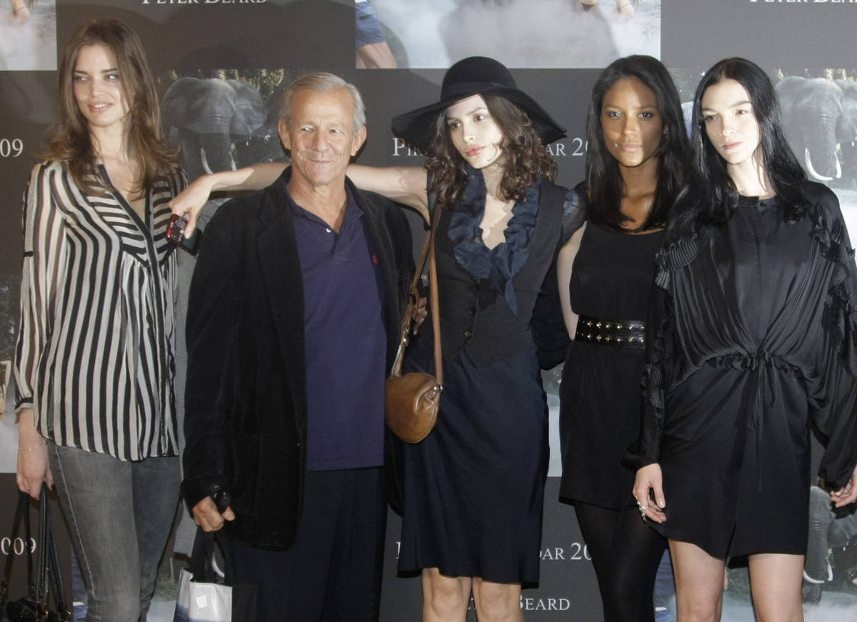 FILE - In this Nov. 20, 2008 file photo, Peter Beard, second left, photographer of the Pirelli ...