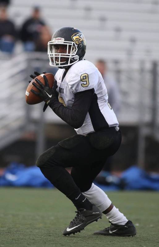 Spring Mountain's Quarterback, Eric Brooks (3), passes the ball during the class 1A state footb ...