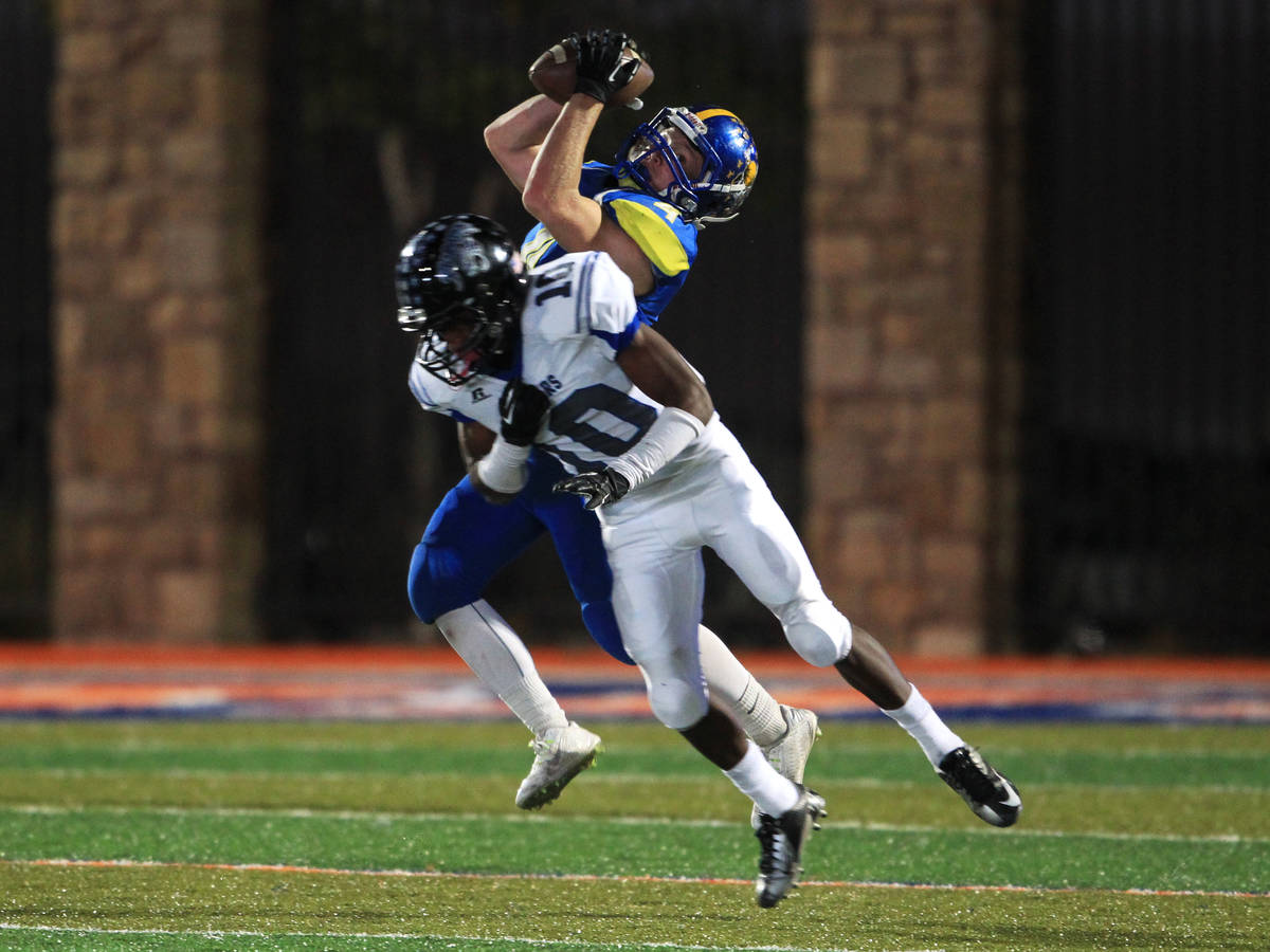 After beating Desert Pines safety Jon McCoy, Moapa Valley's Kaleb Bodily pulls in a fourth-down ...