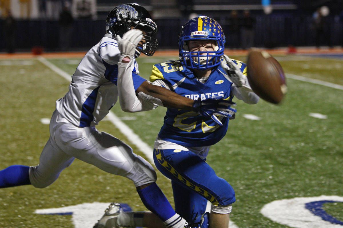 Desert Pines linebacker Isaiah Morris breaks up a pass to Moapa Valley wide receiver Justin Gen ...