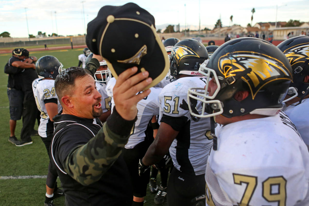 Spring Mountain's Head Coach Aaron Masden congratulates his team after they won the class 1A st ...