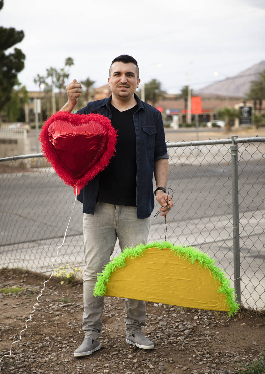 Omar Soto holds pinatas outside his home in Las Vegas, Monday, April 20, 2020. Soto was commiss ...