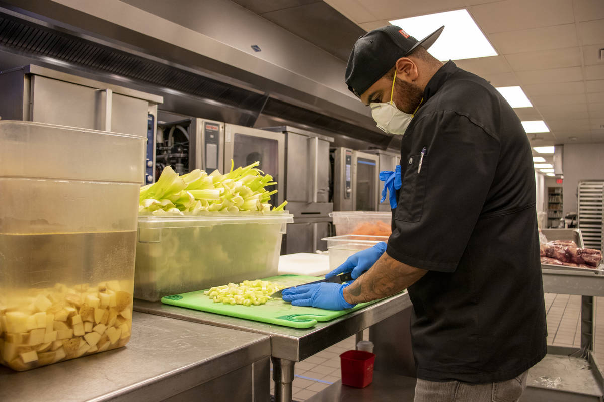 World Central Kitchen volunteer Victor Escalara prepares meals for health care workers. (Sahara ...