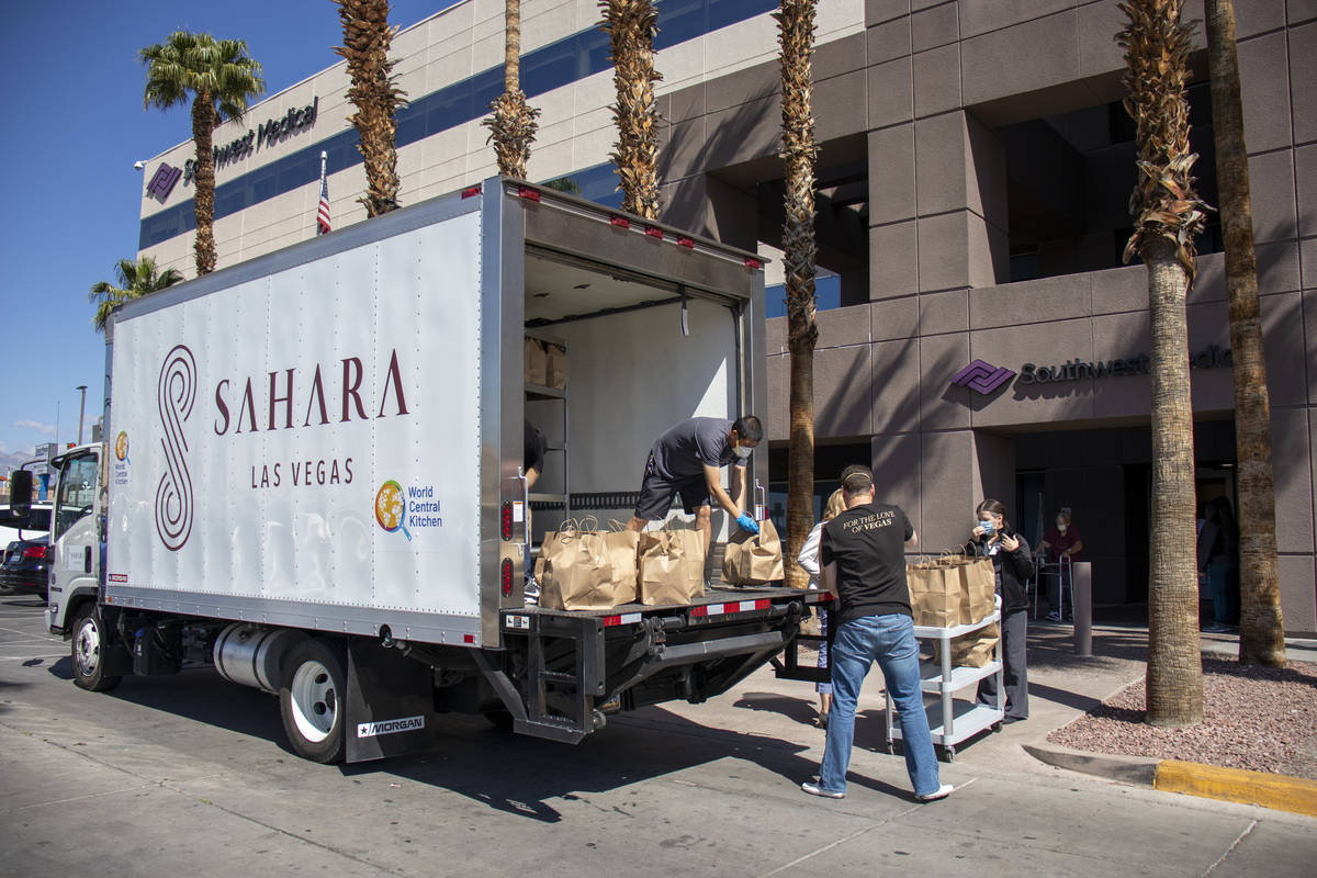 World Central Kitchen volunteers and Southwest Medical employees unload meals at Southwest Medi ...