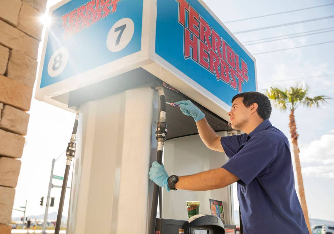 Terrible Herbst employee Bailey Baltins sanitizes gas pumps at Terrible Herbst on St. Rose Pkwy ...