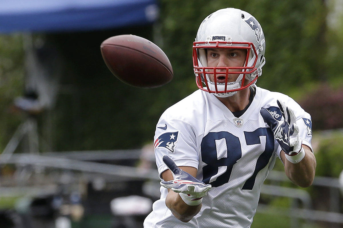 FILE - In this June 7, 2018, file photo, New England Patriots tight end Rob Gronkowski catches ...