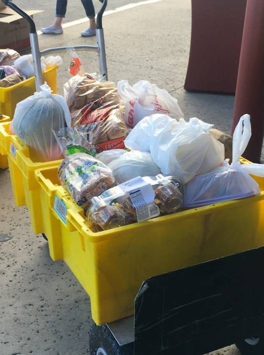 Local restaurant employees received groceries on Saturday from Titan Brands Hospitality Group, ...