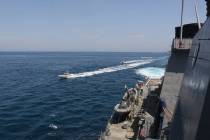 In this Wednesday, April 15, 2020, photo made available by U.S. Navy, Iranian Revolutionary Gua ...