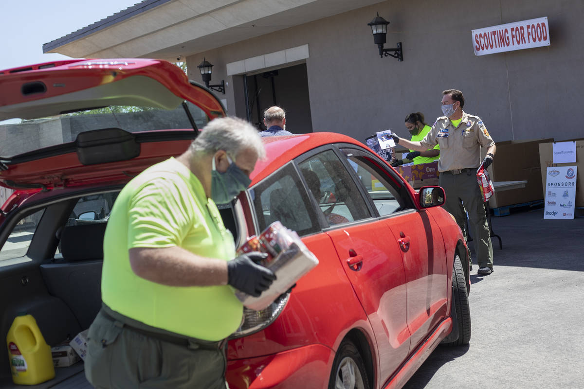 The Las Vegas Council of the Boy Scouts host a “no touch” drive through food driv ...