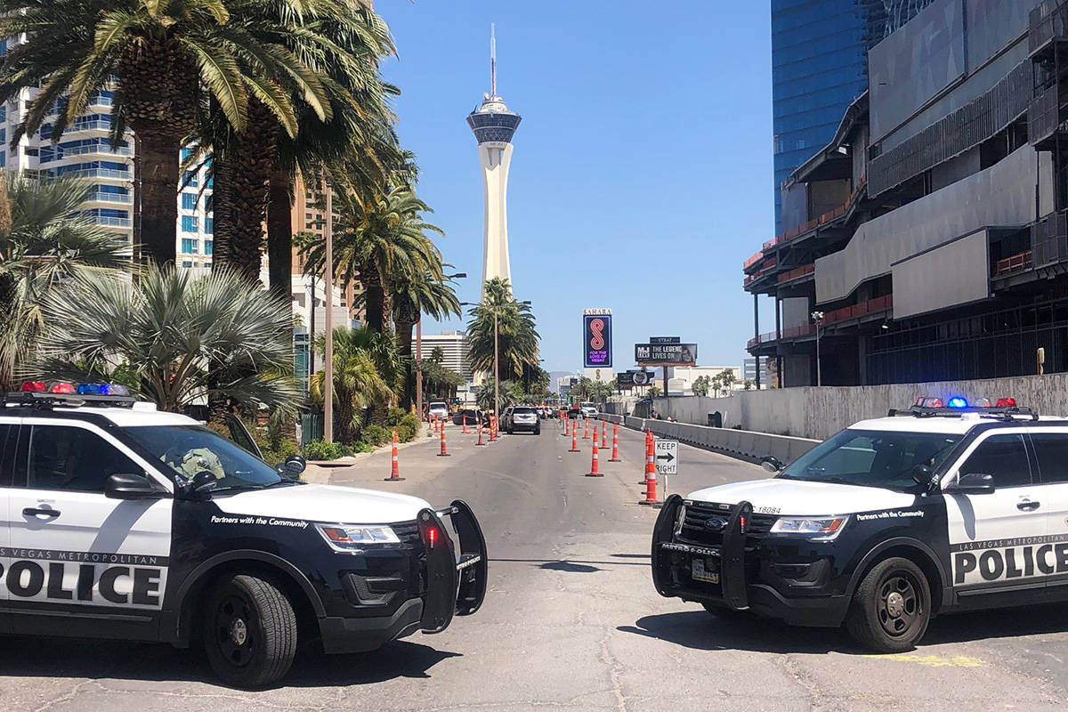 Police investigate a rollover crash on the Las Vegas Strip between Spring Mountain Road and Sah ...