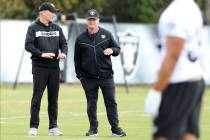 Oakland Raiders general manager Mike Mayock, left, and head coach Jon Gruden watch the team wor ...