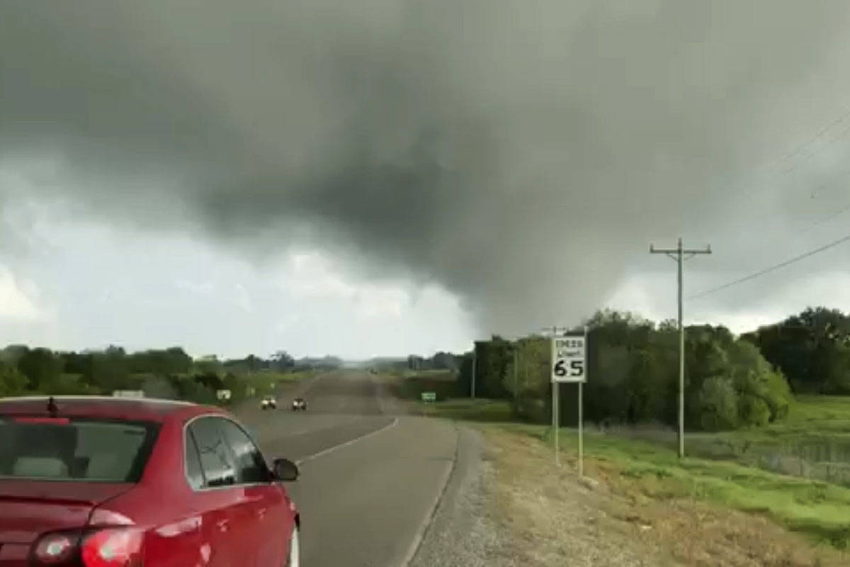 This image made from video provided by Thomas Marcum shows a tornado seen from State Highway 48 ...