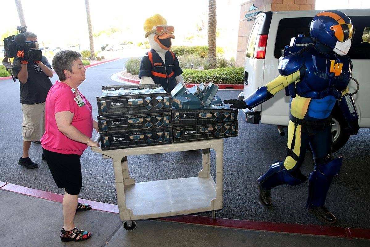 Las Vegas Aviators mascots Spruce and Aviator donate baseball swag at Summerlin Hospital Medica ...