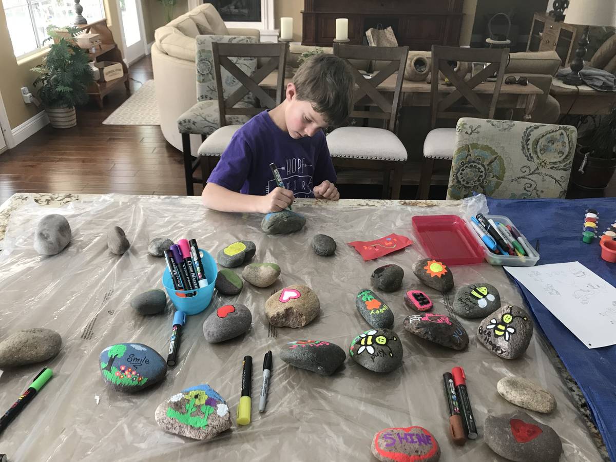 Las Vegas second-grader Braden Hahn paints rocks for neighbors. (Kimberly Hahn)