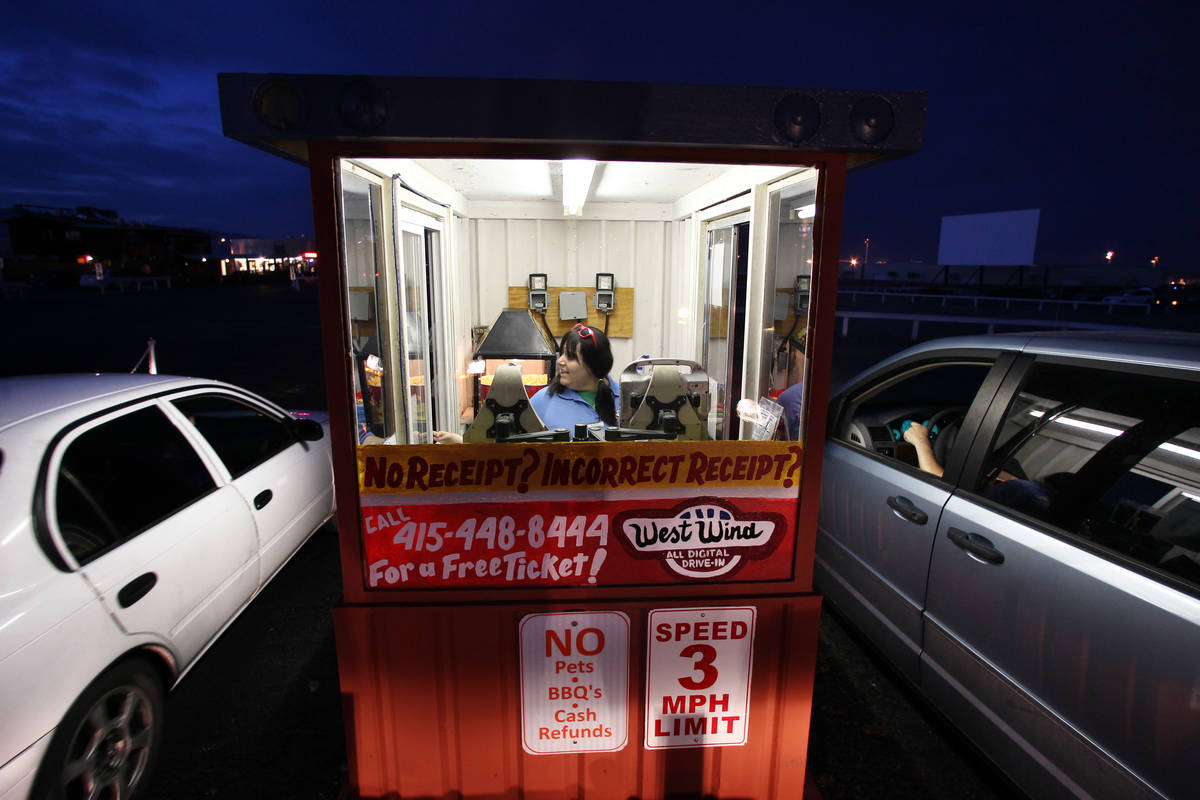 Courtney Garcia takes admission at the West Wind Drive-In Tuesday, May 12, 2015. (Review-Journa ...