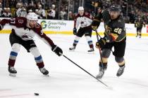 Vegas Golden Knights left wing William Carrier (28) shoots past Colorado Avalanche left wing J. ...