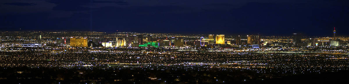 The view of Las Vegas from the base of the Black Mountain Trail as night falls on Wednesday, Ap ...