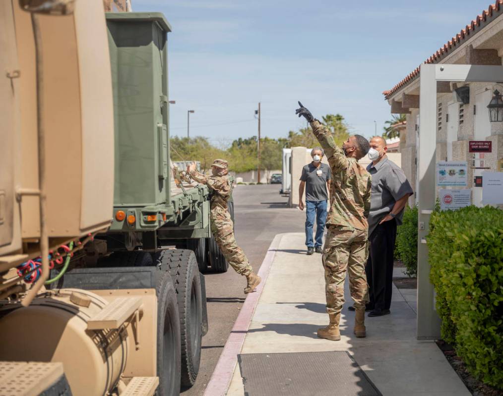 The Nevada National Guard arrive at Silver Hills Health Care Center located on North Buffalo Dr ...