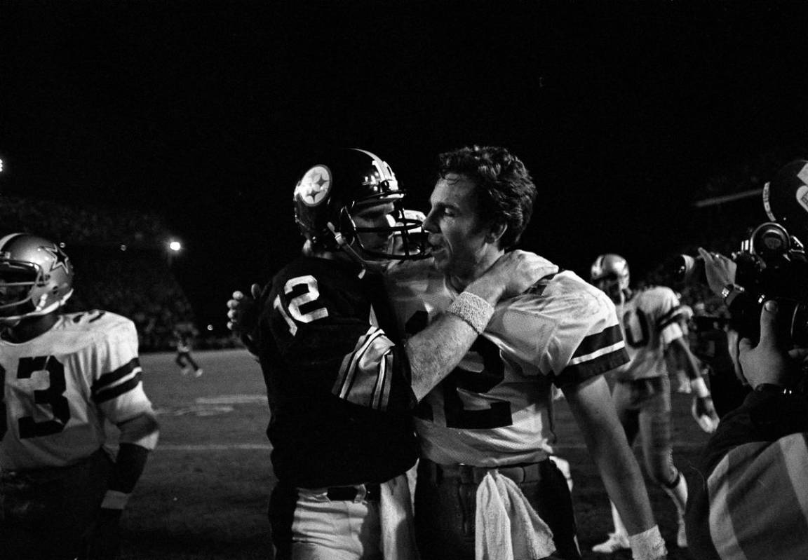 Dallas Cowboys quarterback Roger Staubach, right, and Pittsburgh Steelers quarterback Terry Bra ...