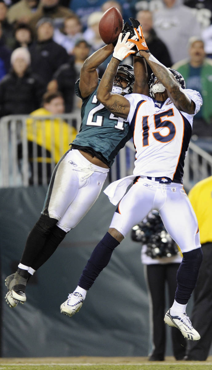 Philadelphia Eagles' Sheldon Brown, left, breaks up a pass intended for Denver Broncos' Brandon ...