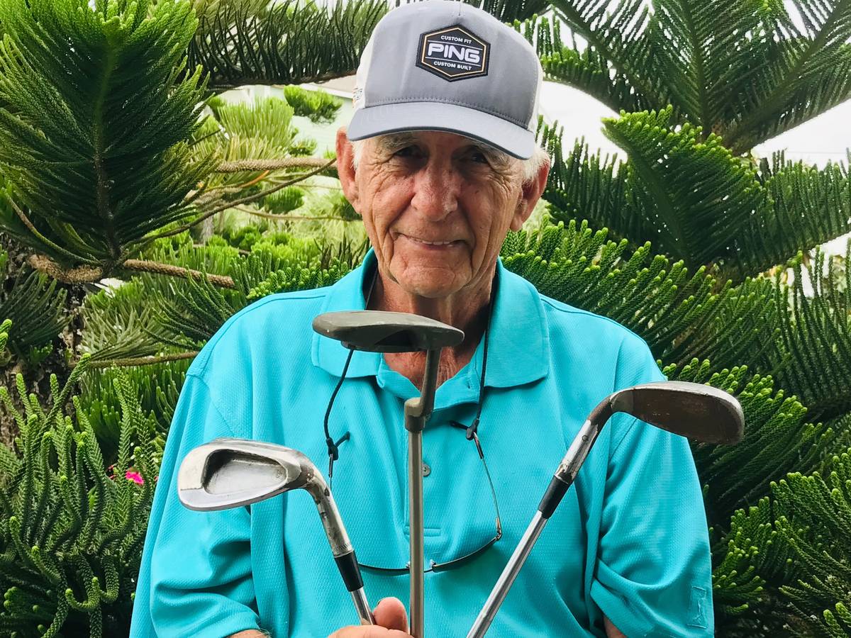 Babe Hiskey, 50 years later, shows off some of the historic PING clubs used to win the 1970 Sah ...