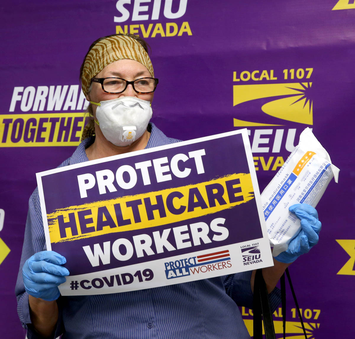 Personal health care worker Barbara Polinsky poses after receiving medical masks at SEIU Local ...