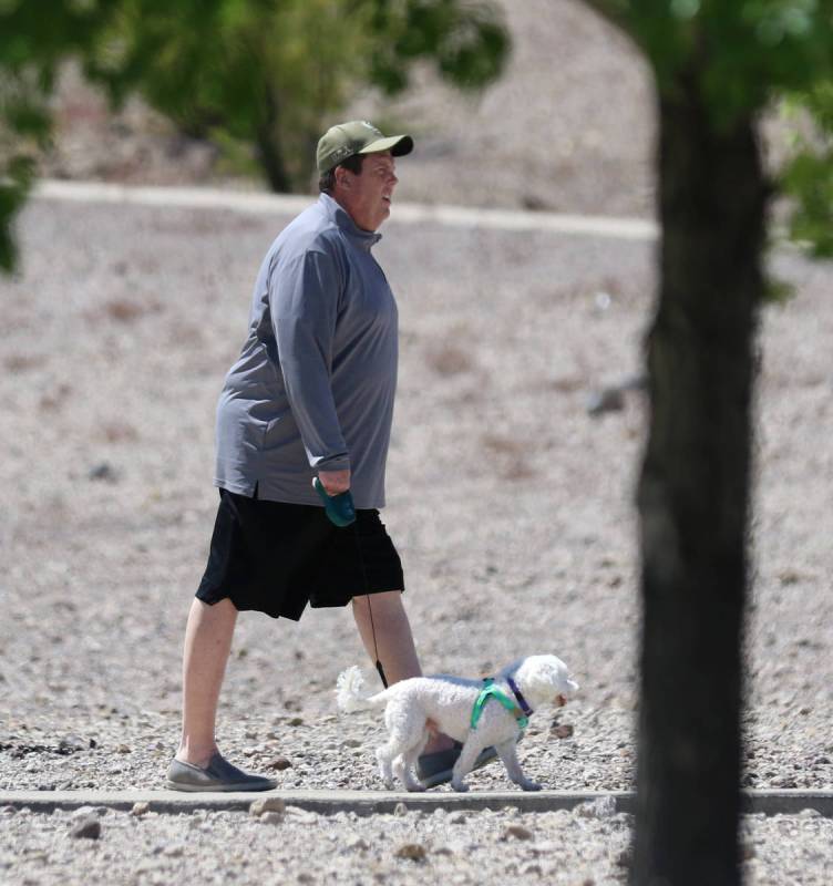 Jim Caranby of Henderson walks with his dog, Marshmello, at Cornerstone Park on Wednesday, Apri ...