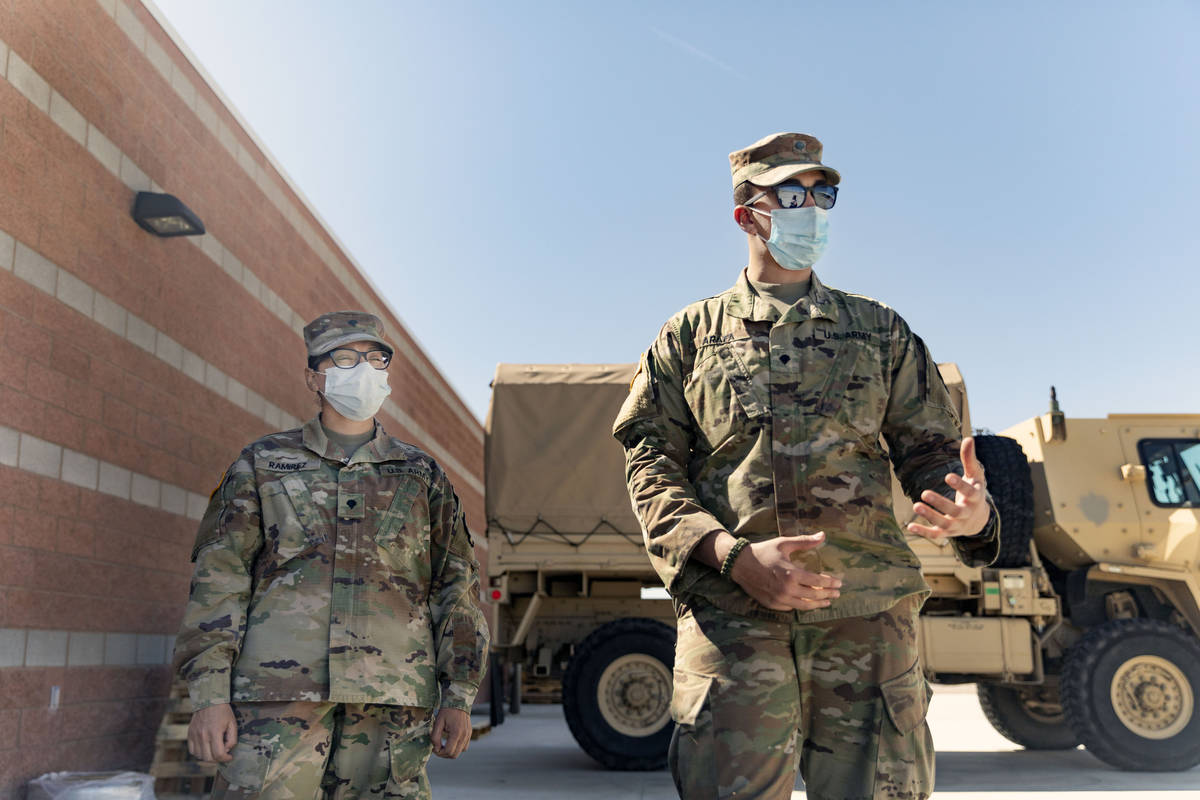 Spc. Iris Ramirez, left, and Spc. Karim Arafa discuss the mission of delivering personal protec ...