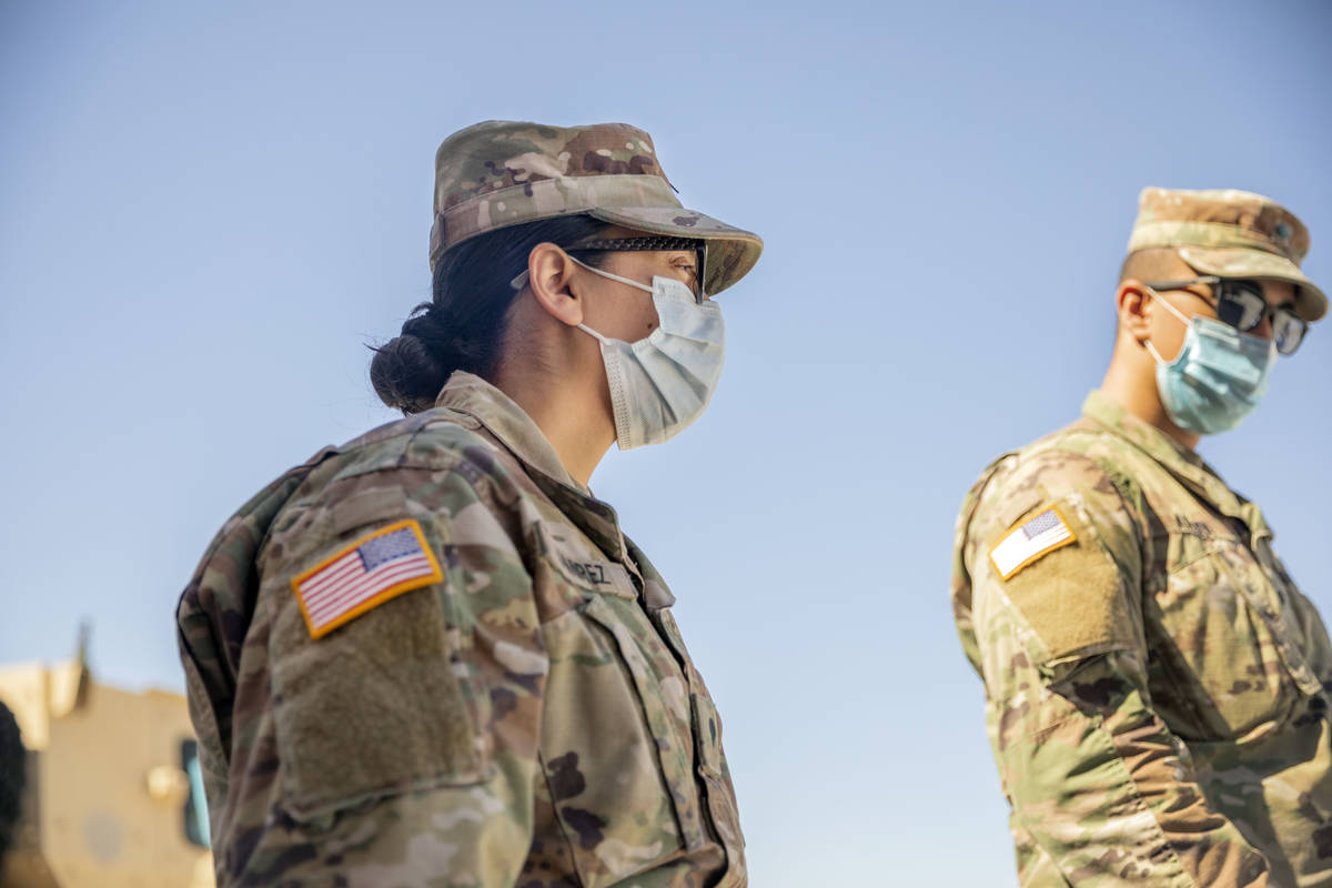 Spc. Iris Ramirez, left, and Spc. Karim Arafa discuss the mission of delivering personal protec ...