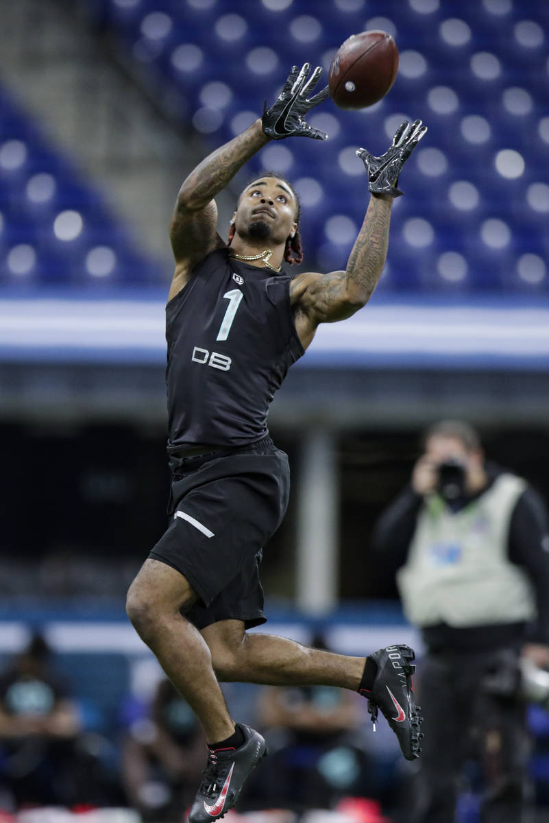 Ohio State defensive back Damon Arnette runs a drill at the NFL football scouting combine in In ...