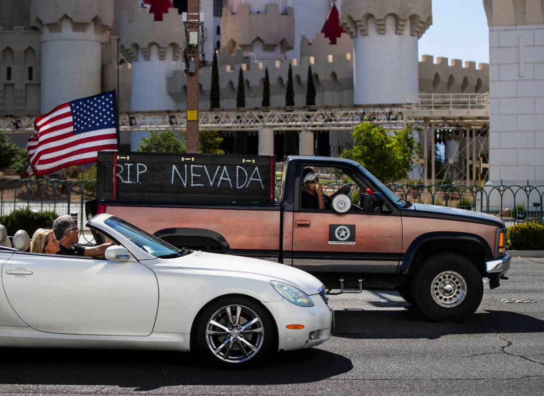 People participate in a "caravan" protest led by Wayne Allyn Root, not pictured, alon ...