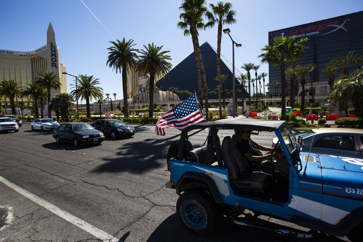 People participate in a "caravan" protest led by Wayne Allyn Root, not pictured, alon ...