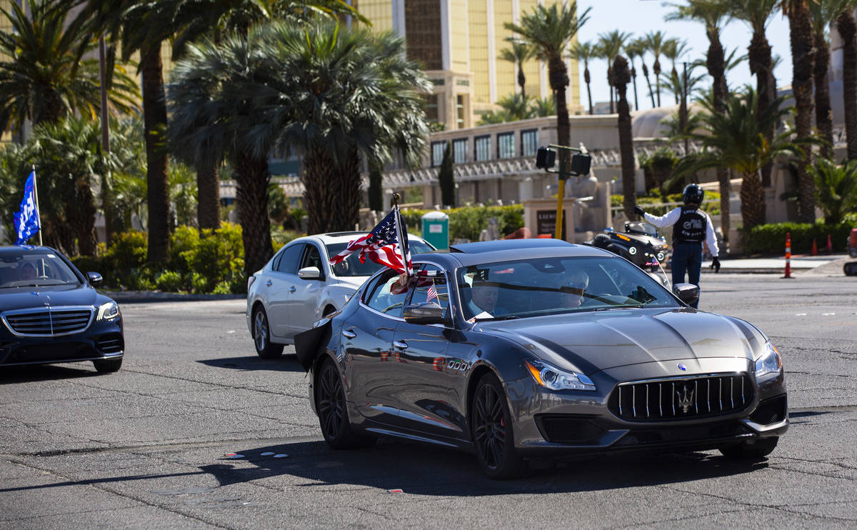 Wayne Allyn Root, sitting in the front passenger seat of a Maserati, leads a "caravan&quot ...