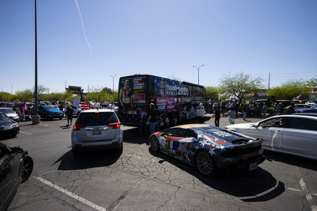 People gather at the Las Vegas South Premium Outlets before participating in a "caravan&qu ...